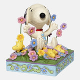 Peanuts by Jim Shore - Snoopy in bed of Flowers Figurine 12 cm